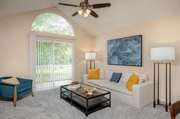 Living Room With Ceiling Fan at Pointe Royal, Overland Park, Kansas